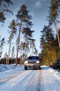 suv, car, driving on small snowy country road, scenery from sweden