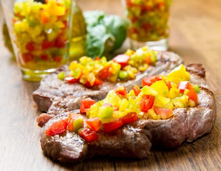 grilled steak meat with cut vegetables