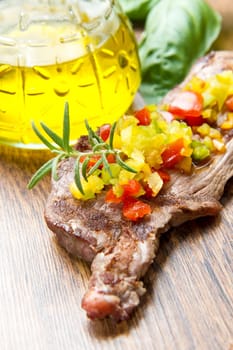 grilled steak meat with cut vegetables