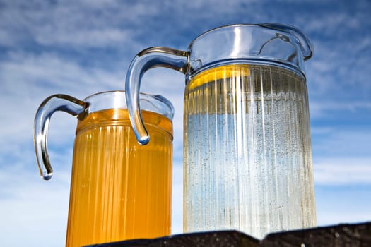 Fresh juice of orange with empty glass container