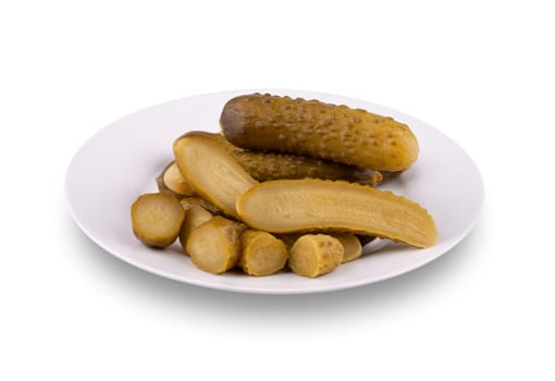 Pickled cucumbers on a plate isolated on white background.