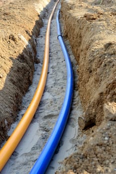 Gas and water pipes in open trenches