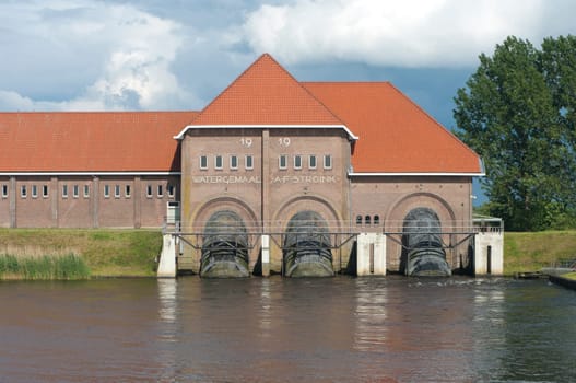 Water pumping station A.F. Stroink in Vollenhove, Netherlands. Built in 1919 and originally steam powered, the purpose was to avoid flooding of the underlying polders. In wet periods 29 workers were needed to keep the station running.
