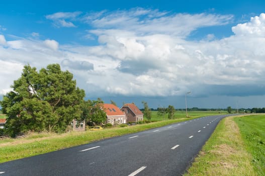 road over a dyke in a typical dutch polder landscape
