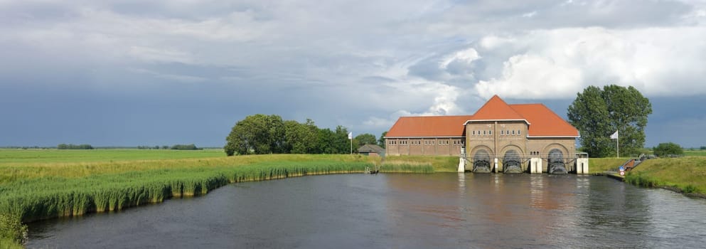 Water pumping station A.F. Stroink in Vollenhove, Netherlands. Built in 1919 and originally steam powered, the purpose was to avoid flooding of the underlying polders. In wet periods 29 workers were needed to keep the station running.