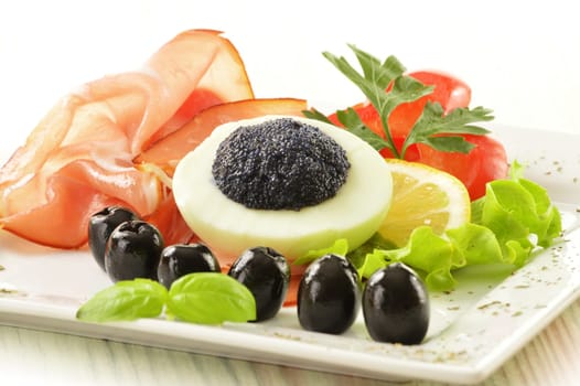 Egg with caviar and garnish