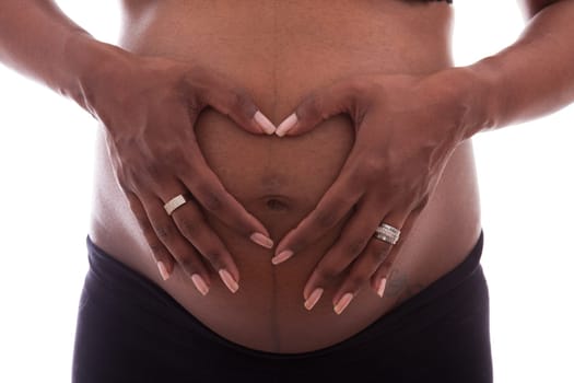 Young beautiful pregnant indian woman touching her belly
