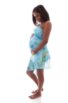 Young beautiful pregnant indian woman touching her belly