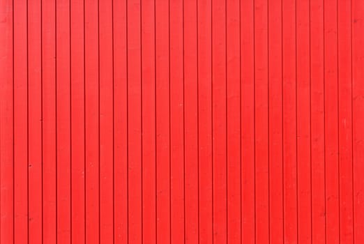Background image of a wooden wall painted in bright red color