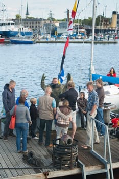 TALLINN, ESTONIA - JULY 14 - Demonstration of immersing of the diver under water at the "Tallinn&#039 s Sea Days 2012"" event, on July 14, 2012 in Tallinn, Estonia."