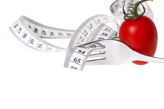 Healthy Eating - Weight Loss with Measure - Measuring Tape Guided by a Fork with a Tomato Against a White Background