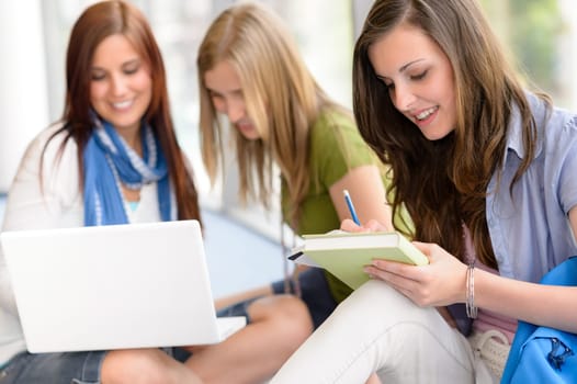 Group of high school students sitting floor self educating