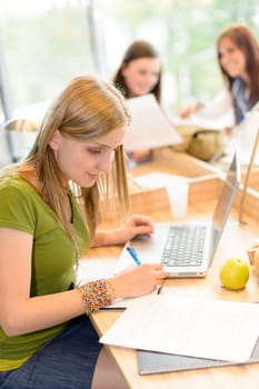 Students group working on computer at study room high school