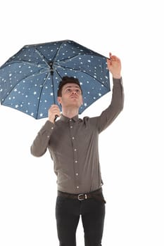 Handsome man with a blue umbrella with stars