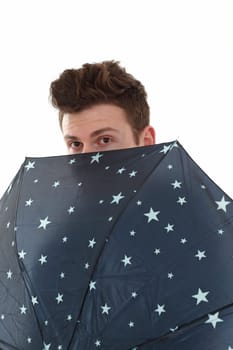 Handsome man with a blue umbrella with stars