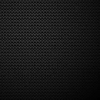 Texture of carbon fiber material. Dark background