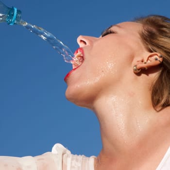 Young woman drinking water
