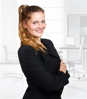 Young blond woman in business wear in office environment