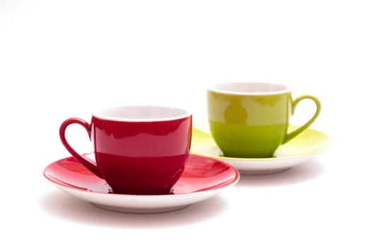 Red and green espresso cup on white background
