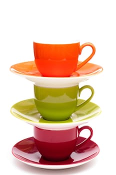 Three colorful espresso cups with saucer