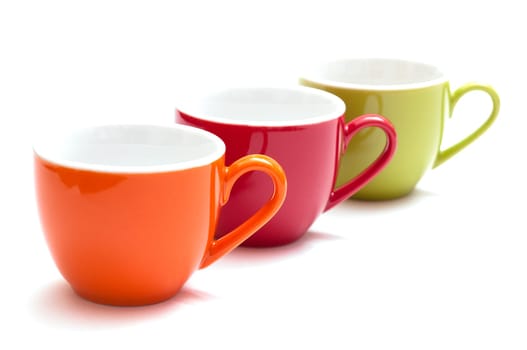 Colorful espresso cups in a row