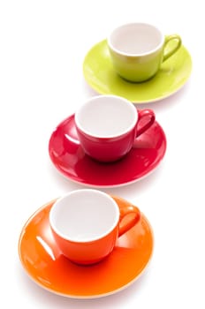 Three colorful coffee cups in orange,red and green