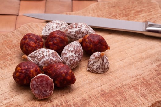 Salami and knife on a board
