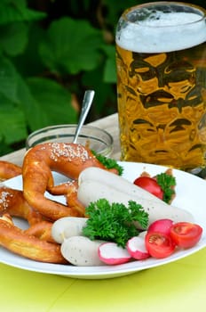 Bavarian snack with white sausages,beer and pretzels