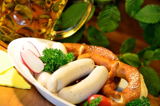Bavarian snack with white sausages,beer and pretzels