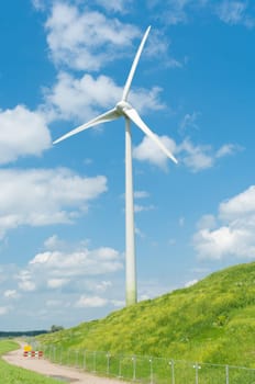 wind turbine on a green hill