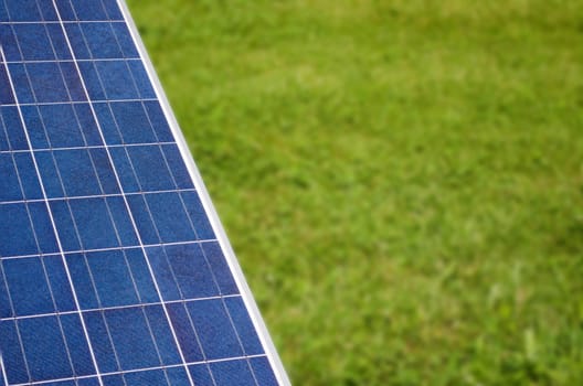 Photovoltaic solar panel and grass, large copyspace