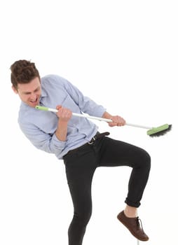 Adult young man singing while cleaning the floor