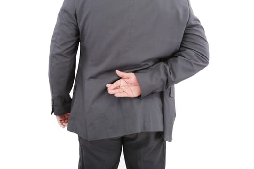 Liar businessman with crossed fingers at back. Isolated on white background