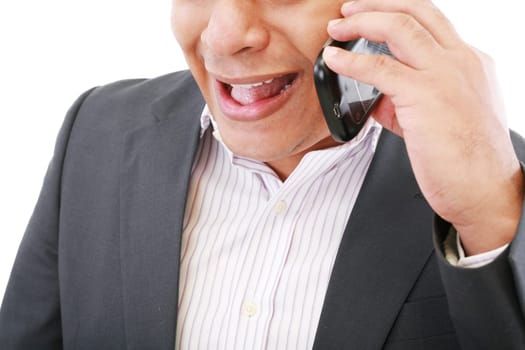 angry young male executive yelling on his mobile phone against white background