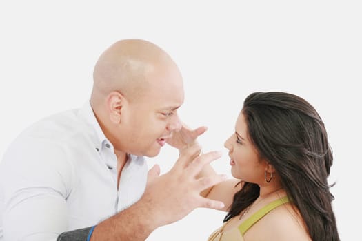 Studio shot of a young couple fighting