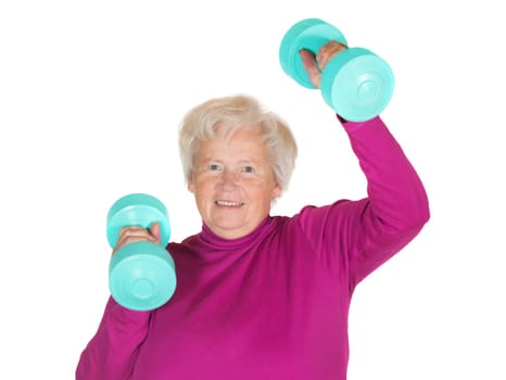 Enthusiastic senior lady working out with weights to maintain her vitality and zest for life in her retirement