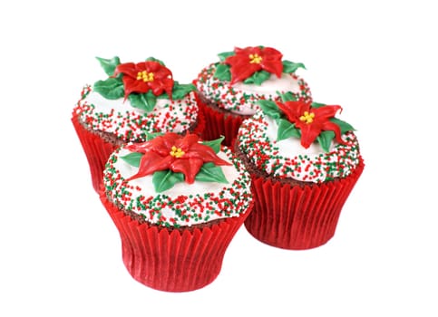 Cupcakes decorated with a Poinsettia made of colored white chocolate