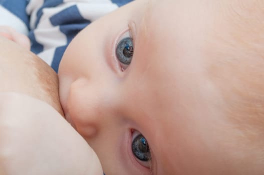Closeup of Mother Breast Feeding Her Baby