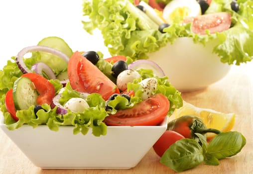 Vegetable salad bowl isolated on white