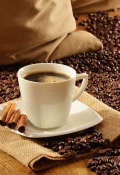 Composition with white cup of coffee