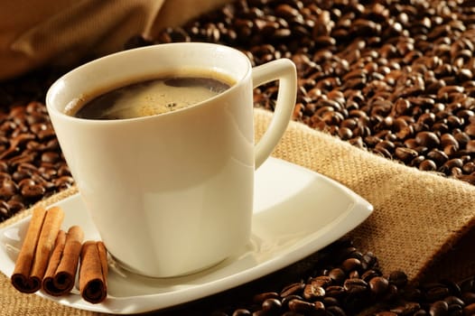 Composition with white cup of coffee