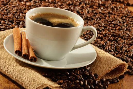 Composition with white cup of coffee