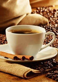 Composition with white cup of coffee