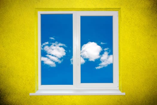 Sky in the window on green painted wall