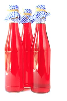 Three bottles of red currant fruit wine