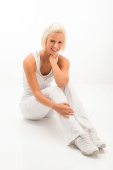 Fitness blonde woman relax during Pilates exercise isolated on white