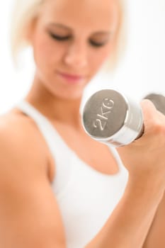 Sportive blond woman exercise biceps with weights isolated on white