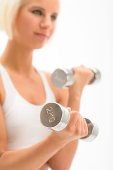 Sportive blond woman exercise biceps with weights isolated on white