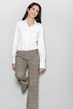 Professional working woman in corporate business trousers and shirt