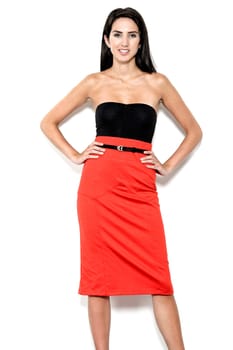 Beautiful sexy young woman in red pencil skirt